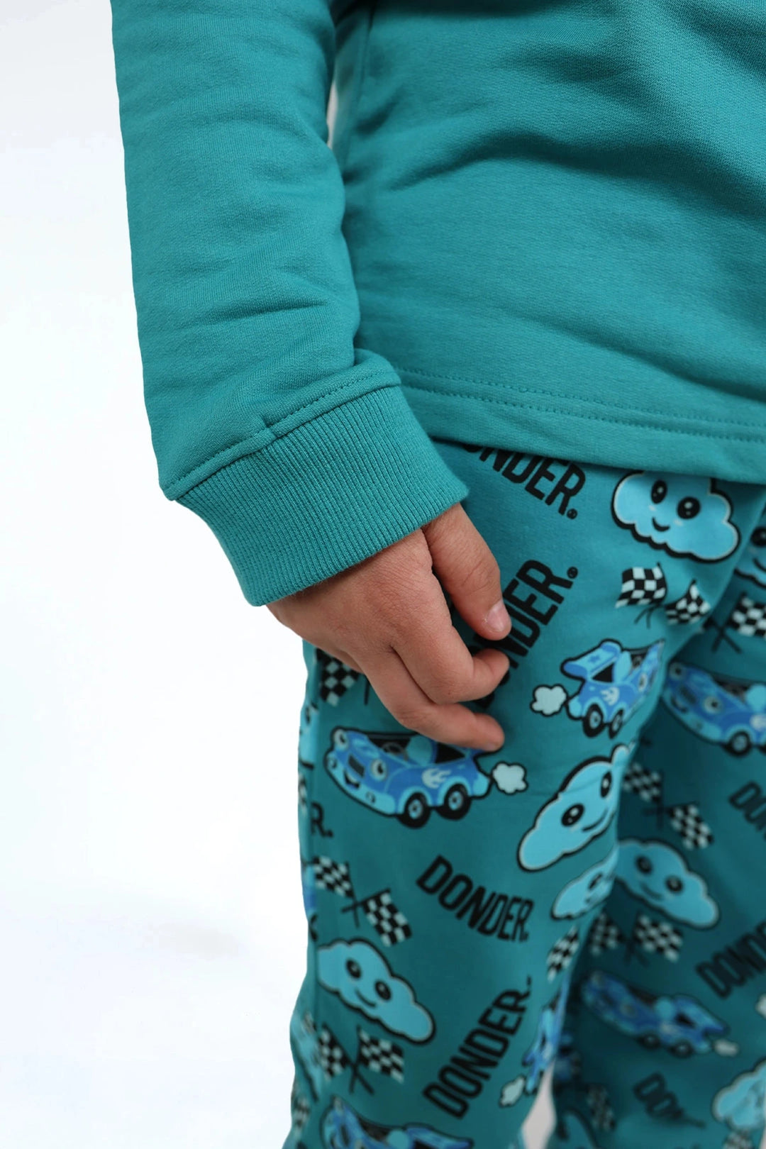 Joggyama Lagoon Drift — combi jogger pyjama kids — close-up | Donder